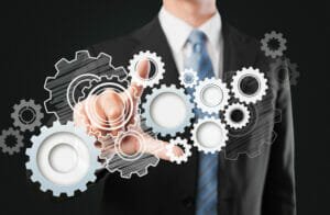 busniess working on industry reorganization - Revitalizing Your Business: The Benefits of Six Sigma Reorganization