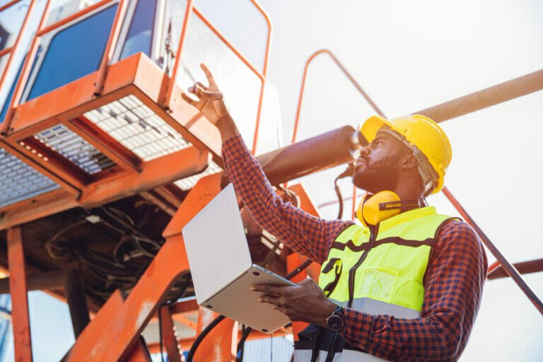 worker pre-checking crane safety regulations - crane safety regulations a guide to ensuring compliance