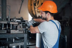 worker installing machine in industry - the machinery installation process from plan to reality