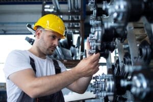 worker repairing equipment - industrial millwrighting trends, challenges, and opportunities in the industry