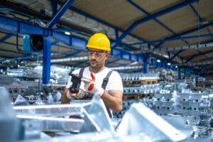 industrial worker starting workon assembly of industrial equipment- full-service machine assembly ensuring optimal performance and longevity