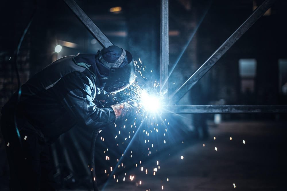 factory worker completing custom metal fabrication