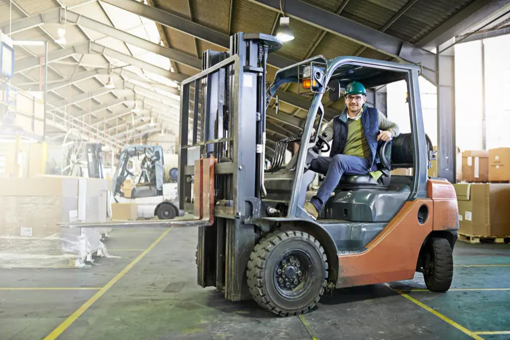 young man ready to move machinery in industrial area - avoiding pitfalls common mistakes in industrial machinery relocation