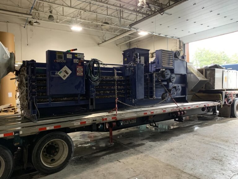 hauling truck moving very hevay industrial equipmwnt during plant relocation