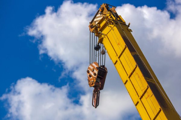 yellow crane ready for complex lift - Mastering Complex Lifts: Strategies for Rigging Heavy and Irregular Loads